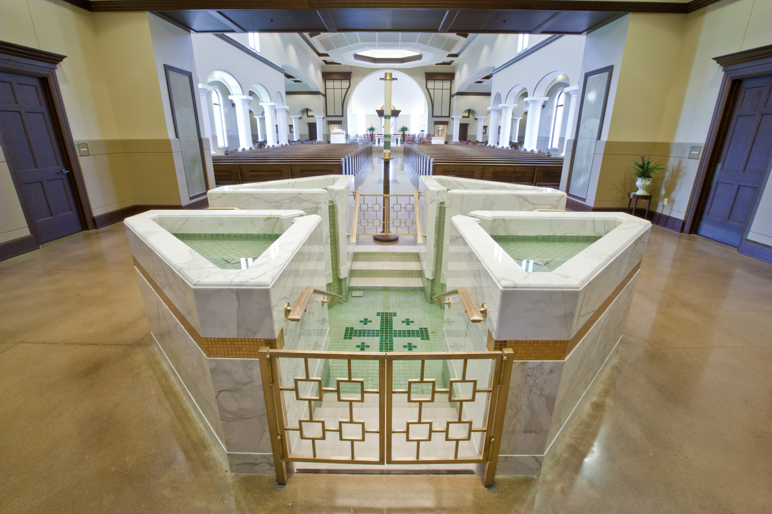 Octagonal Baptismal Font with Four Triangular Upper Bowls with Spillways and Descending and Ascending Steps into a Cruciform Lower Pool, St. Eugene, Oklahoma City, OK.